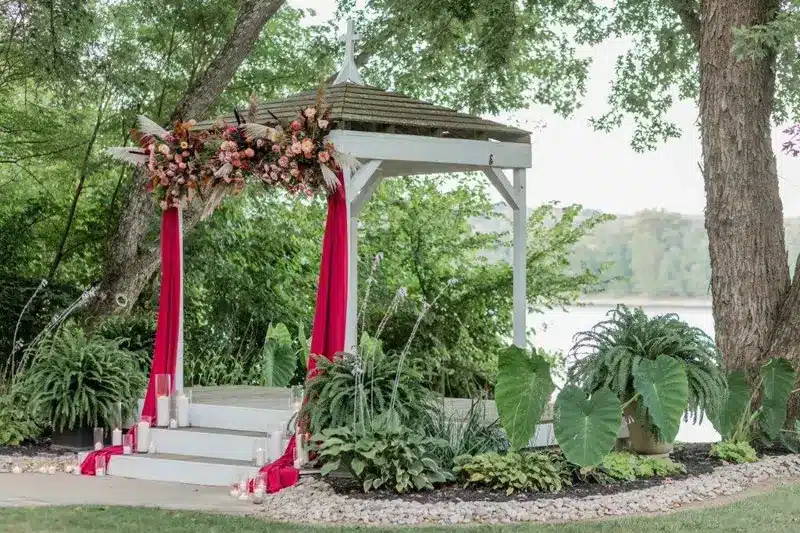 charming outdoor wedding venue for melbourne ky with riverside views and luxurious event spaces for your special day Bridal Alter in front of river at the Inn at Oneonta